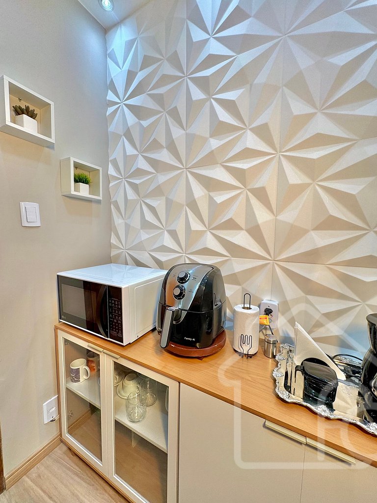 Estúdio no centro com ar-condicionado