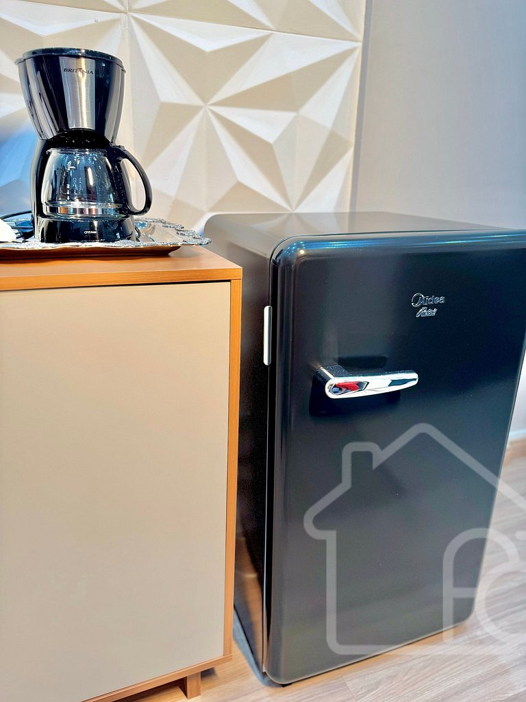 Estúdio no centro com ar-condicionado